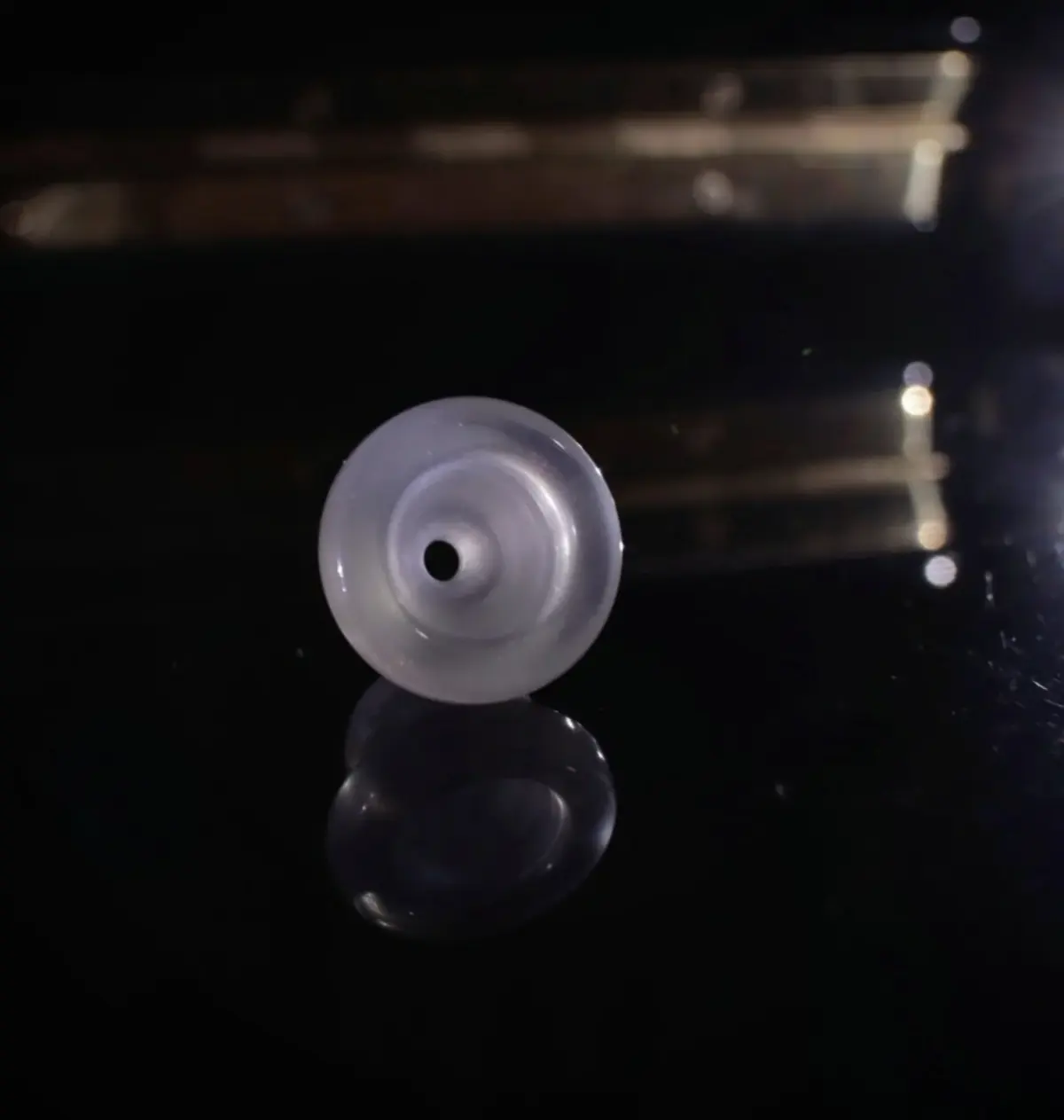 Front view into the cup and throat of a polished Phoenix Brass mouthpiece