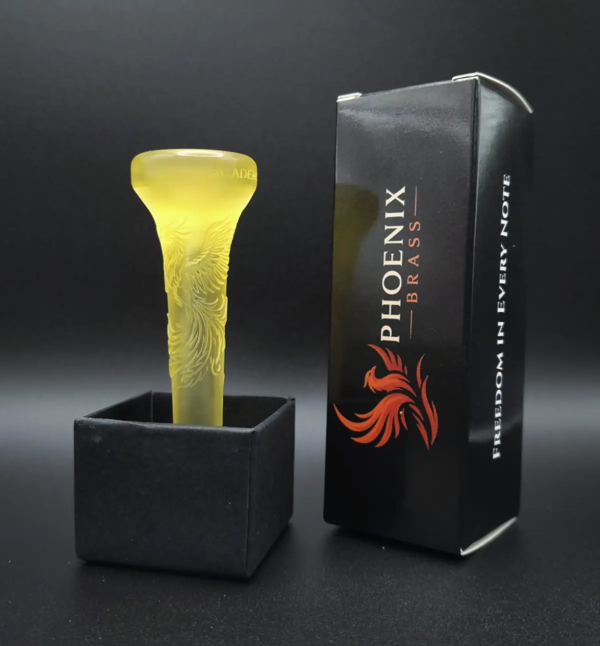 Yellow Phoenix Brass mouthpiece beside its presentation box